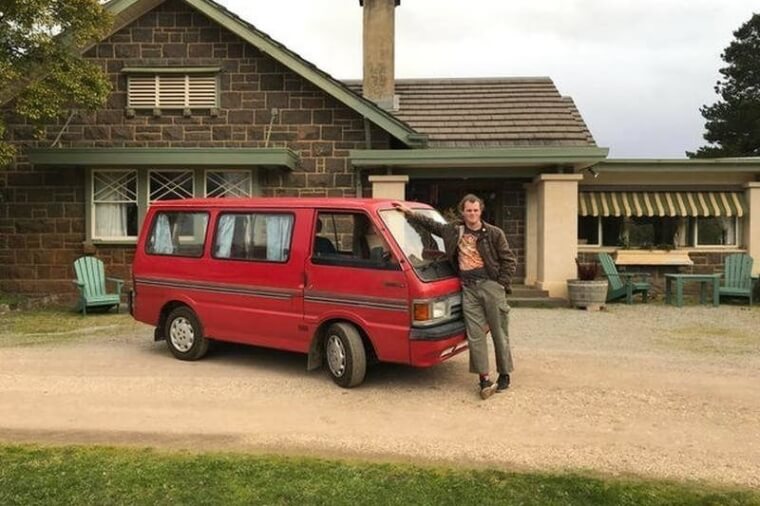 ​A Man Posing With His Van